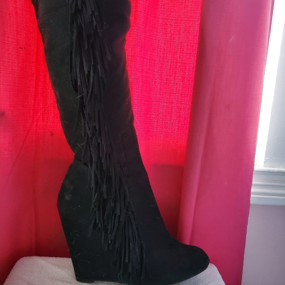 High heeled wedge boots with fringe